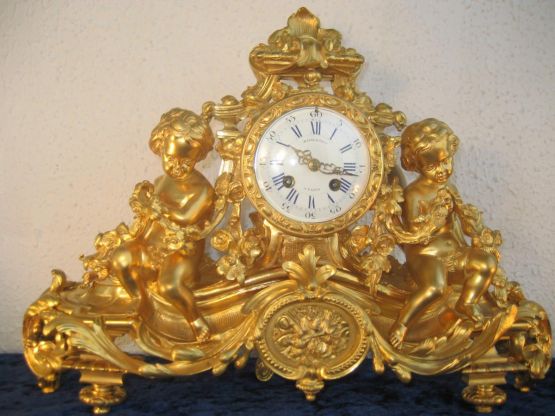 Часы из позолоченной бронзы 'Амуры', XIX в. 